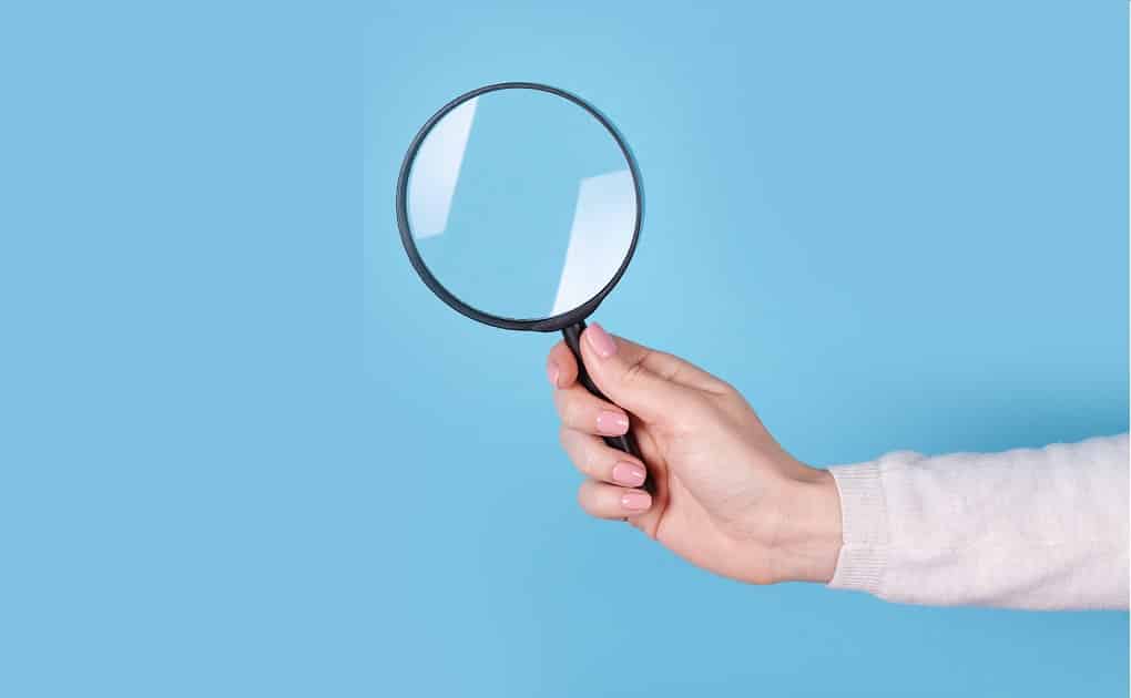 magnifying glass in hand